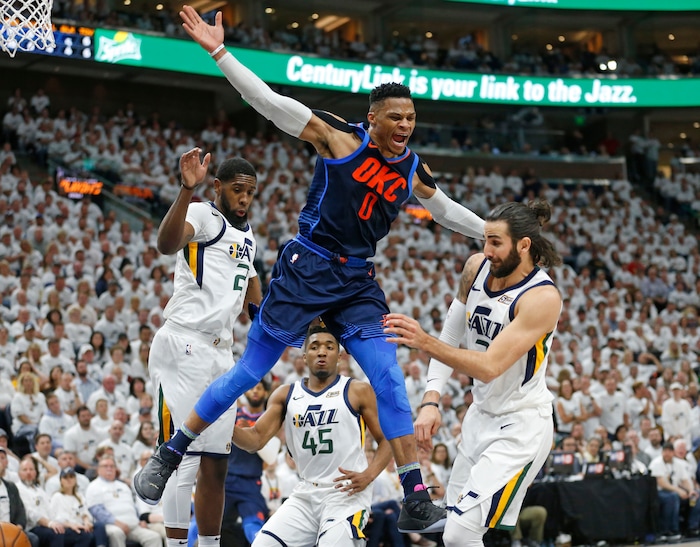 Oklahoma City Thunder guard Russell Westbrook (0) reacts after loosing the ball as Utah Jazz's Royce O'Neale, left, Donovan Mitchell (45) and Ricky Rubio, right, defend in the first half during Game 4 of an NBA basketball first-round playoff series Monday, April 23, 2018, in Salt Lake City. (AP Photo/Rick Bowmer)