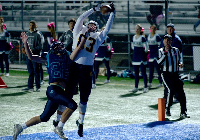 (Leah Hogsten | The Salt Lake Tribune) Summit Academy's Ammon Richards pulls down the touchdown over Juan Diego's Tristen Tonozzi. Summit Academy boys' football team leads Juan Diego High School 51-43 during their game, October 13, 2017 in Draper.