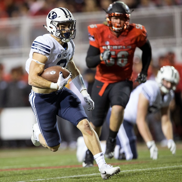 Brigham Young Cougars running back Squally Canada (22) runs the ball against the UNLV Rebels during an NCAA college football game Friday, Nov. 10, 2017, in Las Vegas. (Erik Verduzco/Las Vegas Review-Journal via AP)