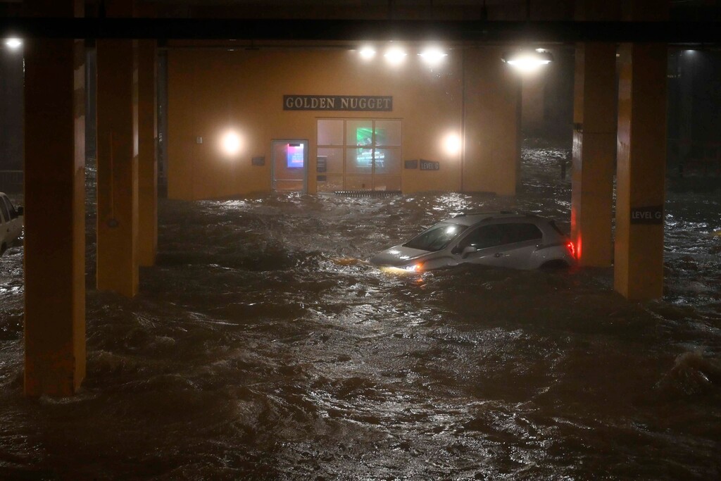 (Lukas Flippo /The Sun Herald via AP)

A vehicle's lights are on as first floor parking garage is flooded from the storm surge of Hurricane Zeta, at the Golden Nugget Biloxi Casino and Resort in Biloxi, Miss., Wednesday night Oct. 28, 2020.