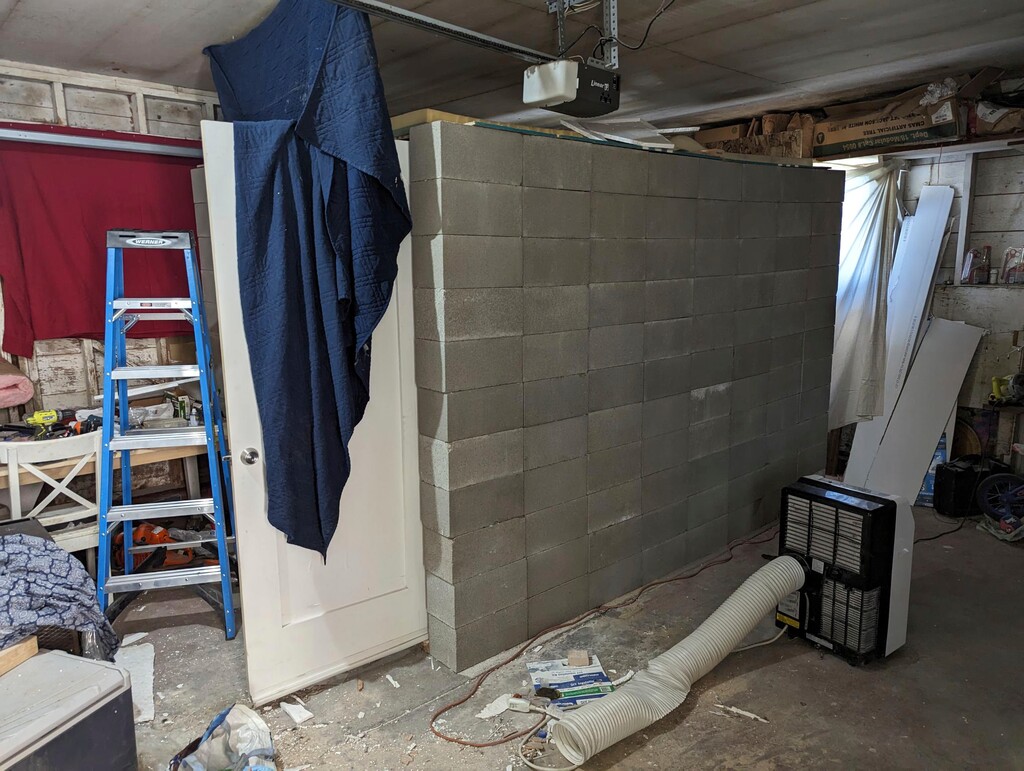 (FBI via AP) This undated photo provided by the Federal Bureau of Investigation's Portland Field Office shows a makeshift cinderblock cell in Klamath Falls, Ore. allegedly used by 29-year-old, Negasi Zuberi. Authorities say Zuberi who posed as an undercover police officer kidnapped a woman in Seattle, drove her hundreds of miles to his home in Oregon, and kept her in a makeshift cell from which she eventually escaped and found help.