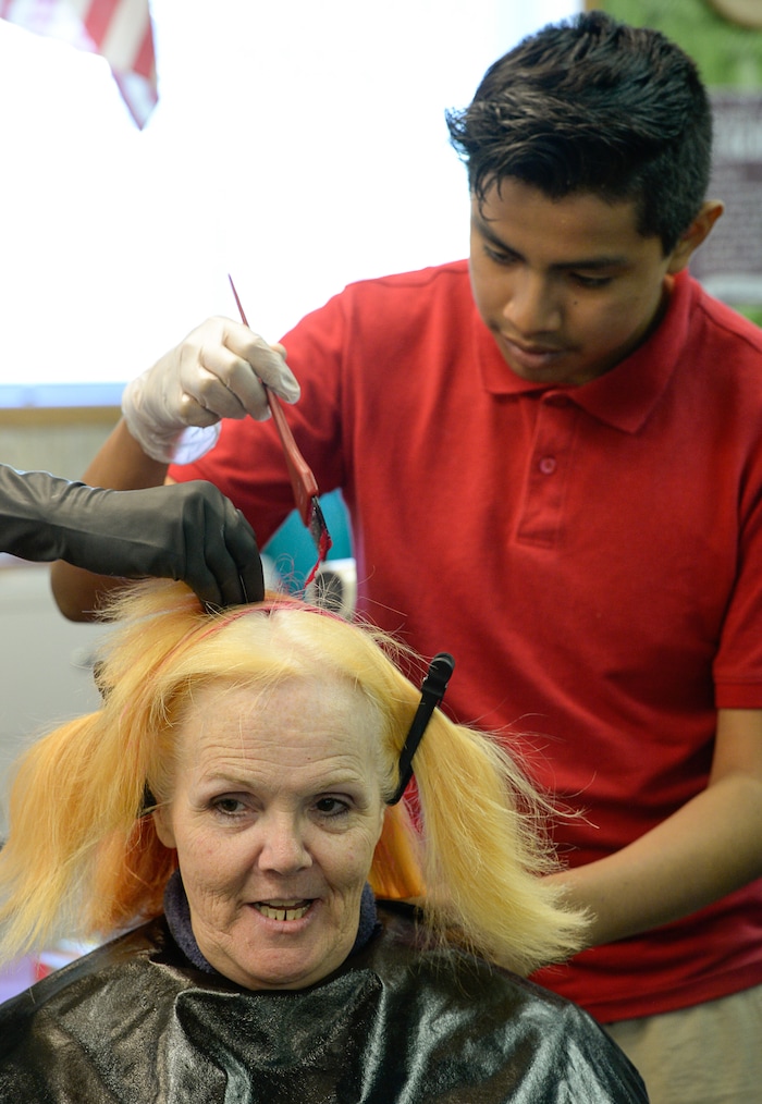 (Francisco Kjolseth  |  The Salt Lake Tribune)  Teachers are using creative ways to get kids SAGE scores up, including Sharon Moore, 6th grade teacher at North Star Elementary who agreed to dye her hair some wild colors as Arturo Vasquez, 12, takes a turn during class on Tuesday, May 8, 2018. This was the incentive that got her kids' scores up nearly 17 percent.