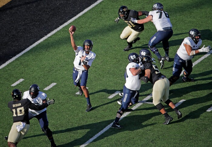 Utah State's Jordan Love (10) looks to pass against Wake Forest in the second half of an NCAA college football game in Winston-Salem, N.C., Saturday, Sept. 16, 2017. (AP Photo/Chuck Burton)