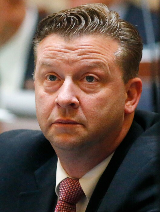 In this Monday, Jan. 22, 2018, photo, Sen. Todd Weiler, R-Woods Cross, looks on as he sits on the Utah Senate floor, in Salt Lake City. Utah lawmakers want to fix gaps in domestic violence law exposed when a man killed his ex-girlfriend and her son by opening fire on a car full of children after school. (AP Photo/Rick Bowmer)