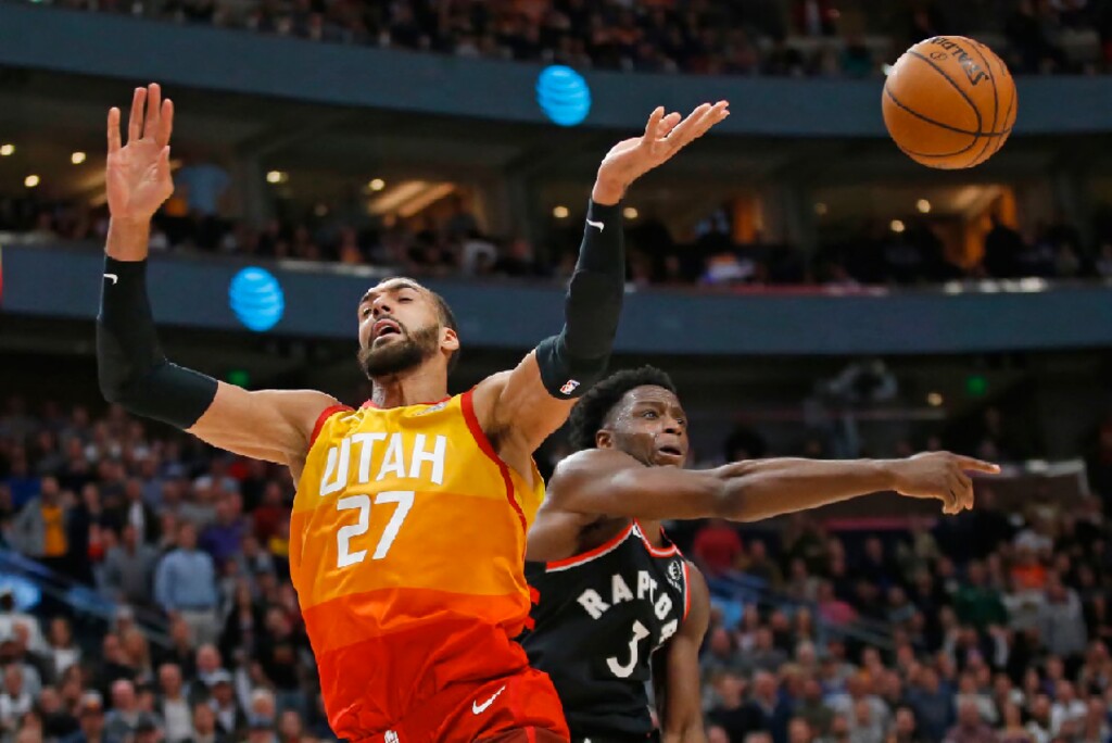 Toronto Raptors forward OG Anunoby (3) knocks the ball from Utah Jazz center Rudy Gobert (27) as he drives to the basket in the second half during an NBA basketball game, Monday, March 9, 2020, in Salt Lake City. (AP Photo/Rick Bowmer)