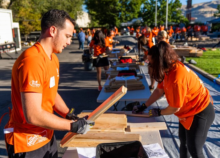(Rick Egan | The Salt Lake Tribune) More than 600 volunteers, led by Home Depot employees, help spruce up the Sunrise Metro and Freedom Landing apartments in Salt Lake City on Wednesday, Sept. 21, 2022.