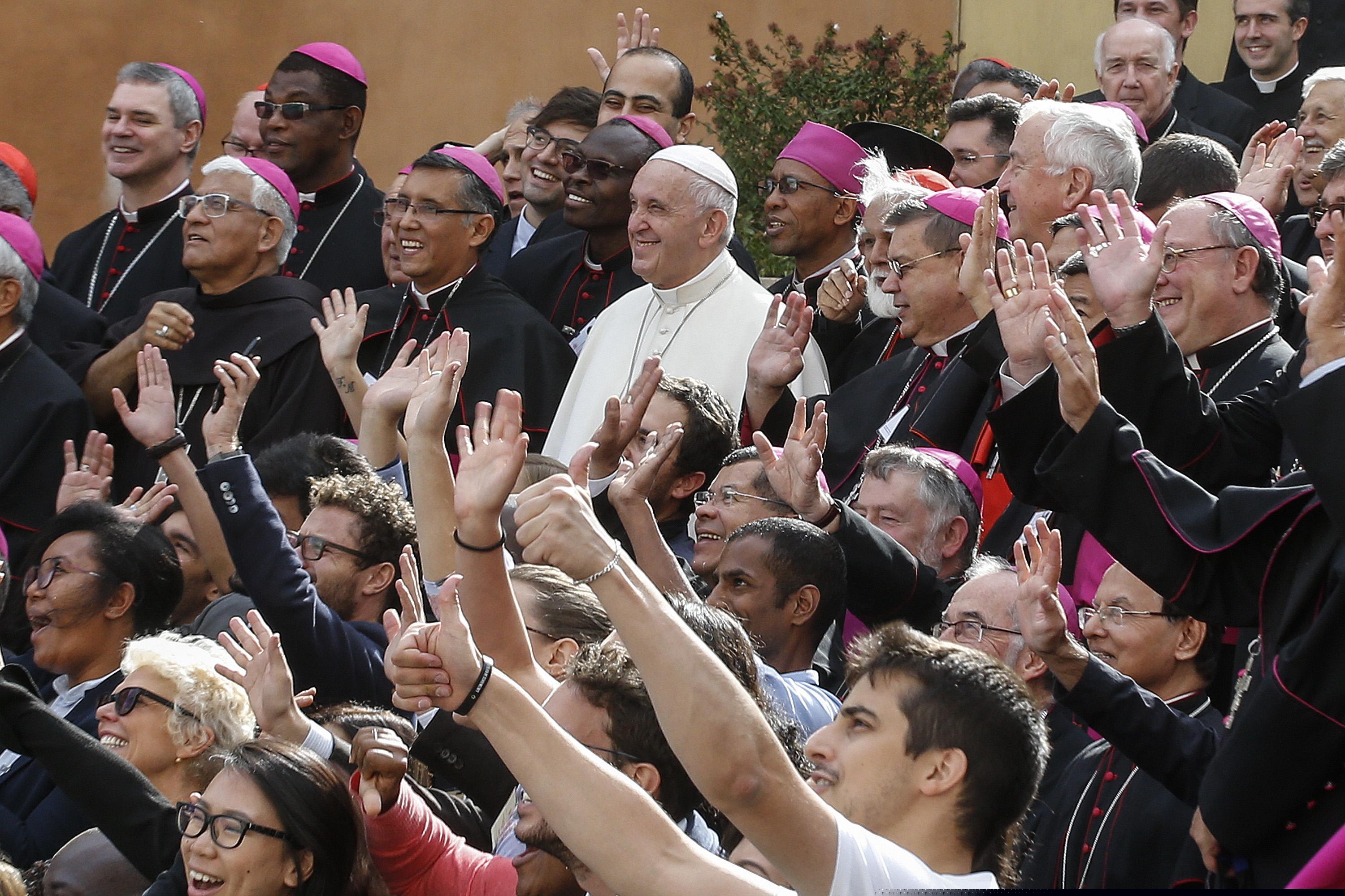 (Fabio Frustaci/ANSA via AP) Pope Francis poses for a group photo with bishops and participants during the last day of the synod of bishops, at the Vatican, Saturday, Oct. 27, 2018.