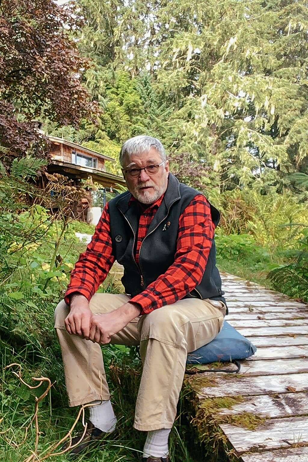 (Annie Tritt | The New York Times) Doug Leen, a retired backcountry dentist who collects and reproduces national park posters created by Works Progress Administration artists, at his home on Alaska’s Kupreanof Island, Aug. 19, 2020. Leen has made it his life’s work to track down as many of the original WPA national park posters as he can, after they were scattered across the country for 70 years with few records.