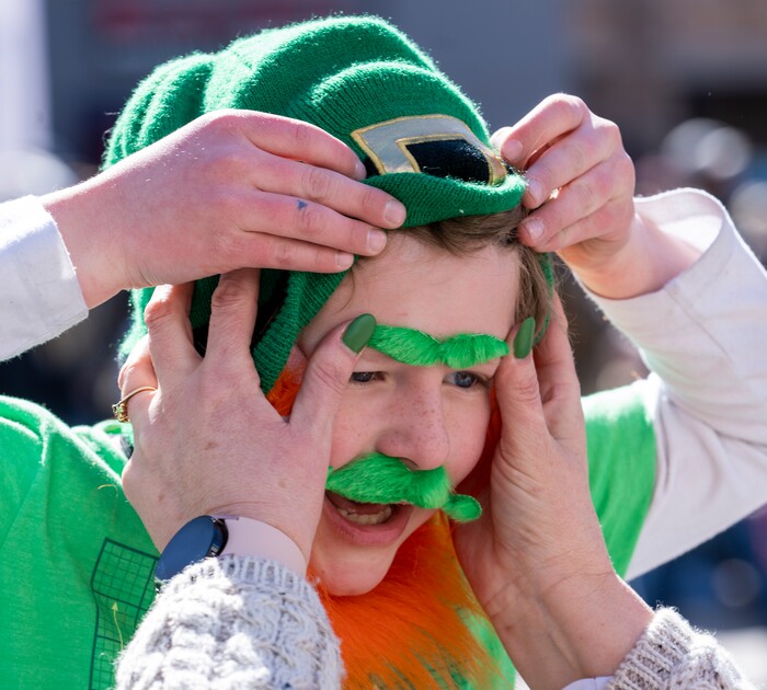 (Rick Egan | The Salt Lake Tribune) A boy named Ryder, is fitted with some green eyebrows, as he prepares for the St. Patrick's Parade at the Gateway in Salt Lake City, on Saturday, March 12, 2022.