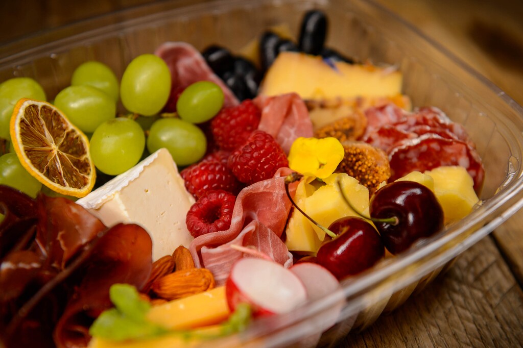 (Trent Nelson | The Salt Lake Tribune) Maven Oak Creative's Adventure Platters come in a biodegradable container. Nicole Simper, owner of Maven Oak Creative, is a self-described "artist, adventurer and avid cheese supporter" who can turn cheese, meat and bread into works of art on a wood charcuterie board. During COVID-19, she is making mini charcuterie boxes for people to enjoy at home. Photographed in Salt Lake City on Friday, July 17, 2020.