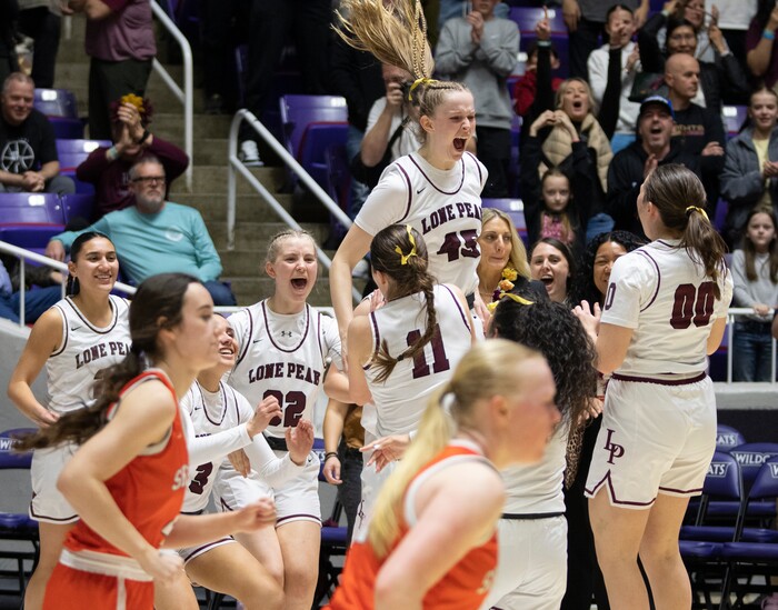 (Rick Egan | The Salt Lake Tribune) Lone Peak celebrates their win over the Skyridge Falcons, in the 6A girls Championship Game between Skyridge and Lone Peak, at Weber State, on Saturday, March 4, 2023.
