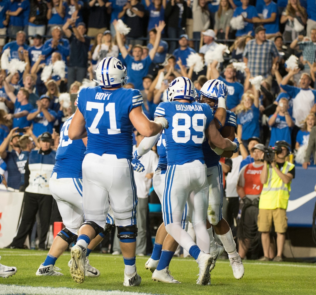 (Rick Egan  |  The Salt Lake Tribune)  The Brigham Young Cougars celebrate the touchdown by Cougar running back Ula Tolutau (5), in football action BYU vs Utah, at Lavell Edwards Stadium in Provo, Saturday, September 9, 2017.