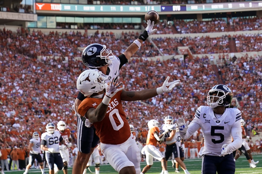 BYU safety Crew Wakley, left, tips away a pass intended for Texas tight end Ja'Tavion Sanders (0) during the second half of an NCAA college football game in Austin, Texas, Saturday, Oct. 28, 2023. (AP Photo/Eric Gay)