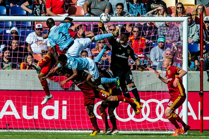 (Chris Detrick  |  The Salt Lake Tribune)  Real Salt Lake goalkeeper Nick Rimando (18) makes a save against Sporting Kansas City defender Ike Opara (3) and Sporting Kansas City forward Latif Blessing (9) during the game at Rio Tinto Stadium Sunday, October 22, 2017.  