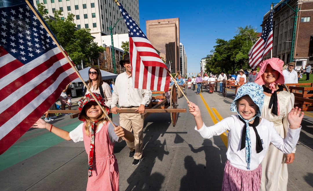 (Rick Egan | The Salt Lake Tribune) Kjersti Orme 9, Kaya Coombs 9, and Venna Orme, 11 walk in the Days of '47 Parade with the Sons of the Utah Pioneers, in Salt Lake City, on Friday, July 23, 2021.