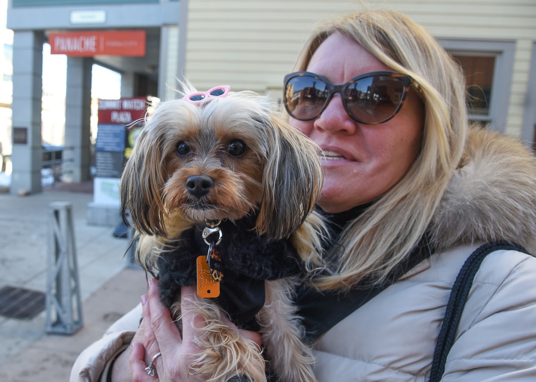 (Francisco Kjolseth  |  The Salt Lake Tribune)  Lori Ney from the Philly area keeps her yorkie poodle Ava warm as they stroll Main street in Park City for the start of the Sundance Film Festival Friday, Jan. 25, 2019.