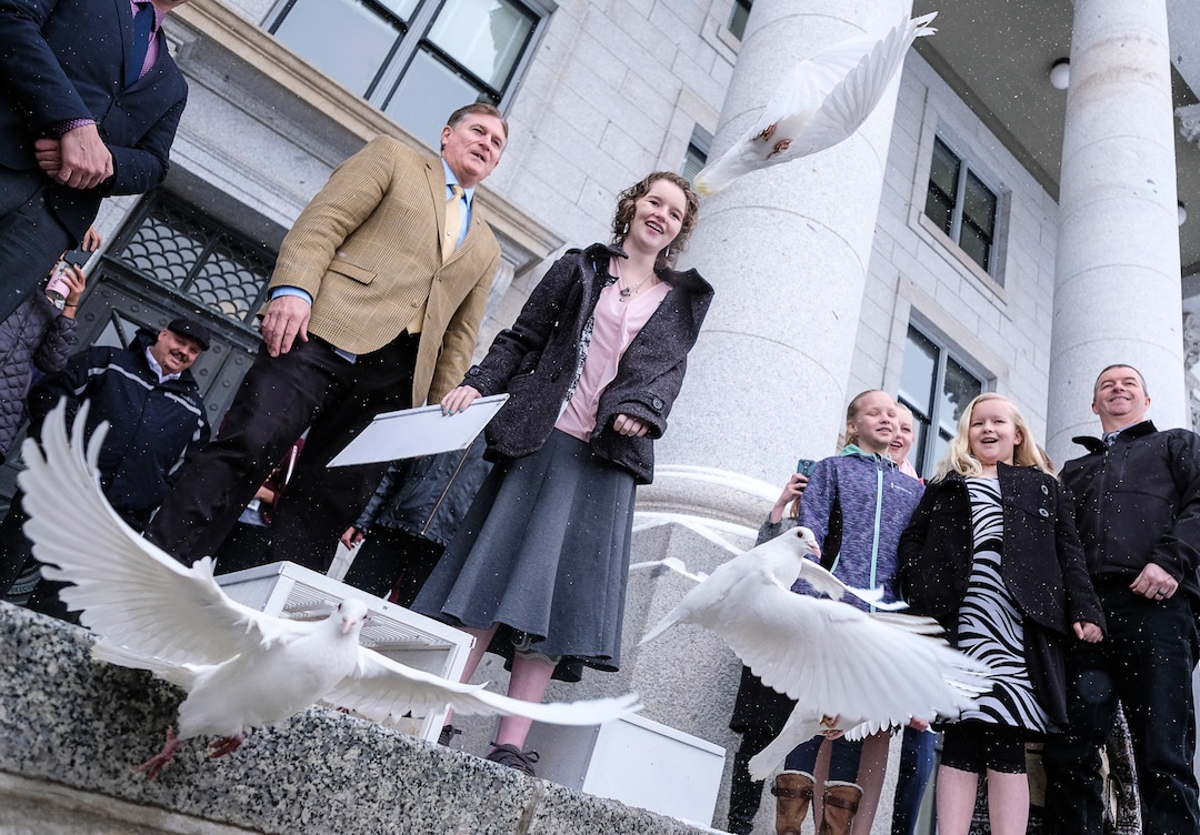 (Francisco Kjolseth  |  The Salt Lake Tribune)  Rep. Val Potter, R-Logan, is joined by Deserae Turner as they release 25 doves on the front steps of the Utah Capitol on Tuesday, Feb. 20, 2018, representing the number of attempts for every suicide death. Turner, a Utah teenage girl who survived being shot in the head by two boys was there to bring attention to bullying and its connection to suicide. 