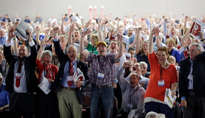 FILE - In this April 23, 2016, file photo, delegates cheer during the Utah Republican Party 2016 nominating convention in Salt Lake City. Utah's Republican Party is pressing on with a legal battle that's divided the state GOP and will argue before a Denver-based appeals court Monday, Sept. 25, 2017, that a state candidate nominating law violates its rights. (AP Photo/Rick Bowmer, File)