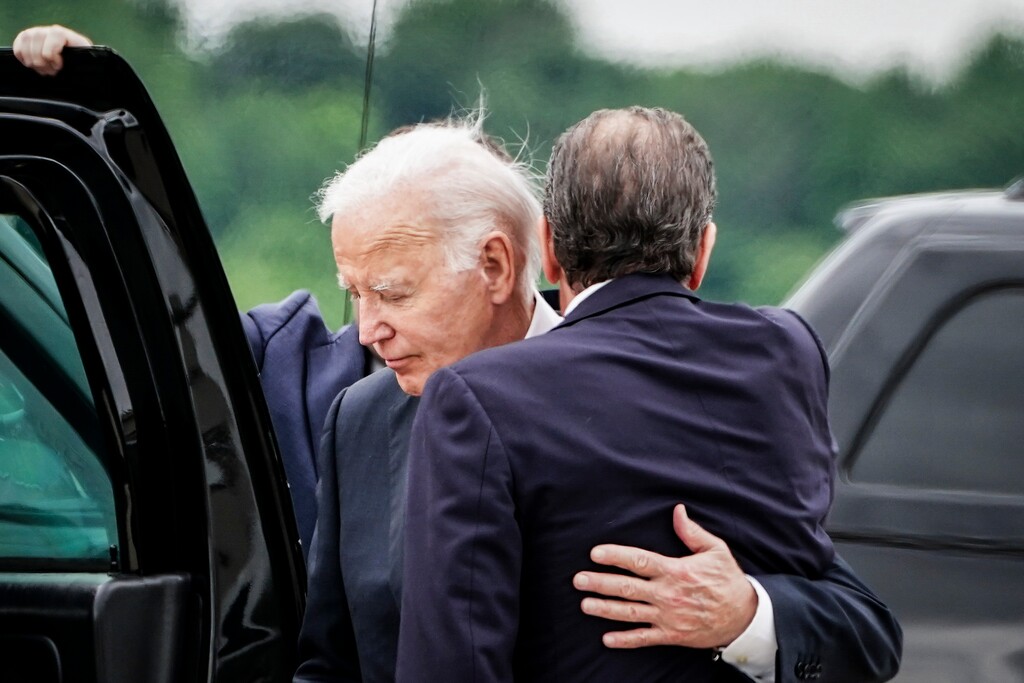 (Haiyun Jiang | The New York Times) President Joe Biden embraces his son Hunter Biden on the tarmac after arriving in Wilmington, Del., on Tuesday, June 11, 2024.