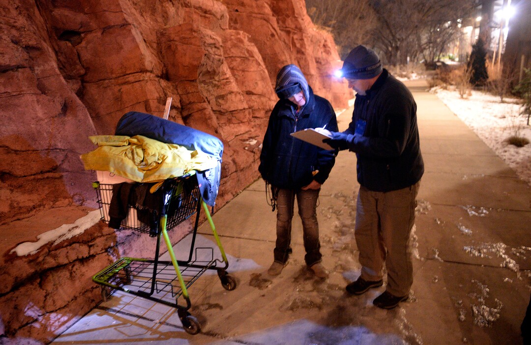 (Al Hartmann  |  The Salt Lake Tribune) 	
Shawn Spalding, with Volunteers of America outreach, right, interviews Tammy, who said that she's been homeless for the past 13 years, during the annual Point In Time count of homeless people in Salt Lake City at 5 a.m. Thursday,  Jan. 25, 2018.