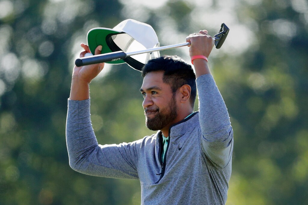 Tony Finau celebrates at the end of the final round after winning the Houston Open golf tournament Sunday, Nov. 13, 2022, in Houston. (AP Photo/Michael Wyke)