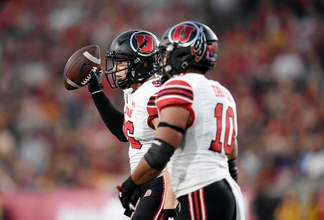 Utah defensive end Nick Heninger, left, reacts after recovering a fumble as linebacker Sunia Tauteoli looks on during the first half of an NCAA college football game against Southern California in Los Angeles, Saturday, Oct. 14, 2017. (AP Photo/Kelvin Kuo)