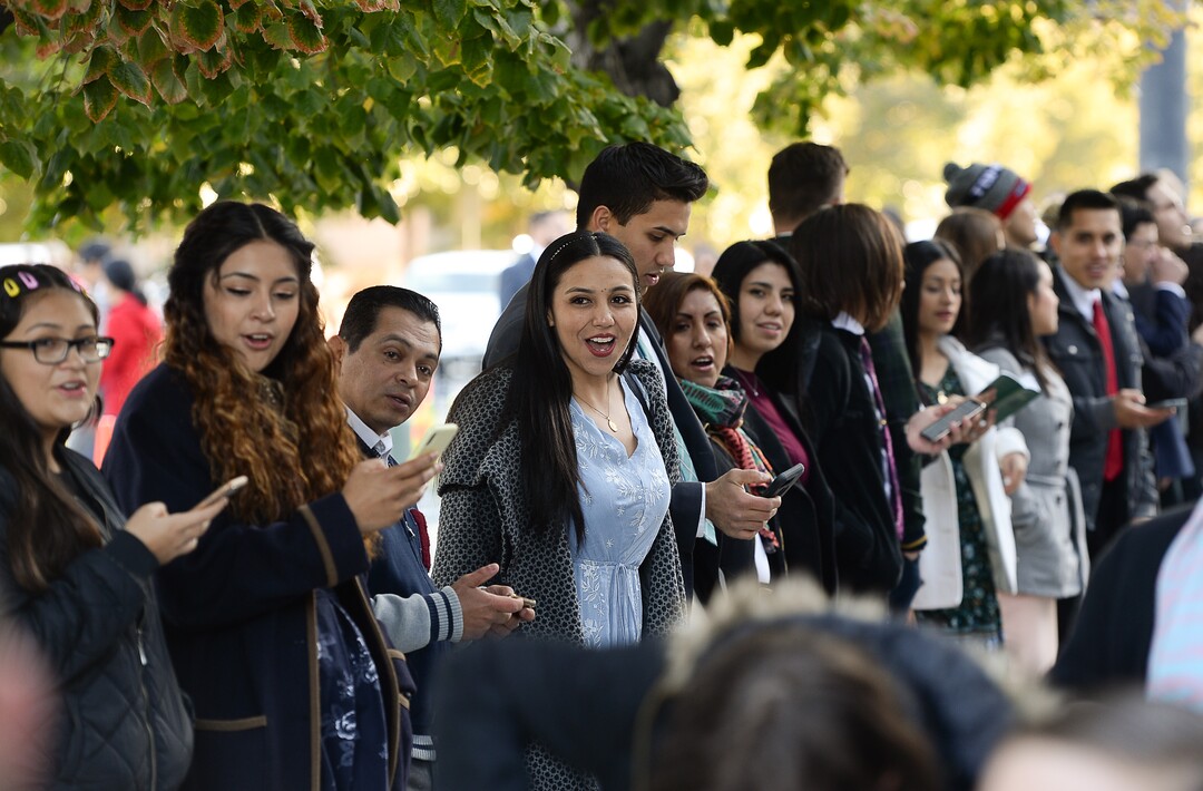 (Francisco Kjolseth  |  The Salt Lake Tribune)  The faithful sing hymnals in Spanish as people arrive for the Sunday session of the 189th twice-annual General Conference of The Church of Jesus Christ of Latter-day Saints at the Conference Center in Salt Lake City on Sunday, Oct. 6, 2019.