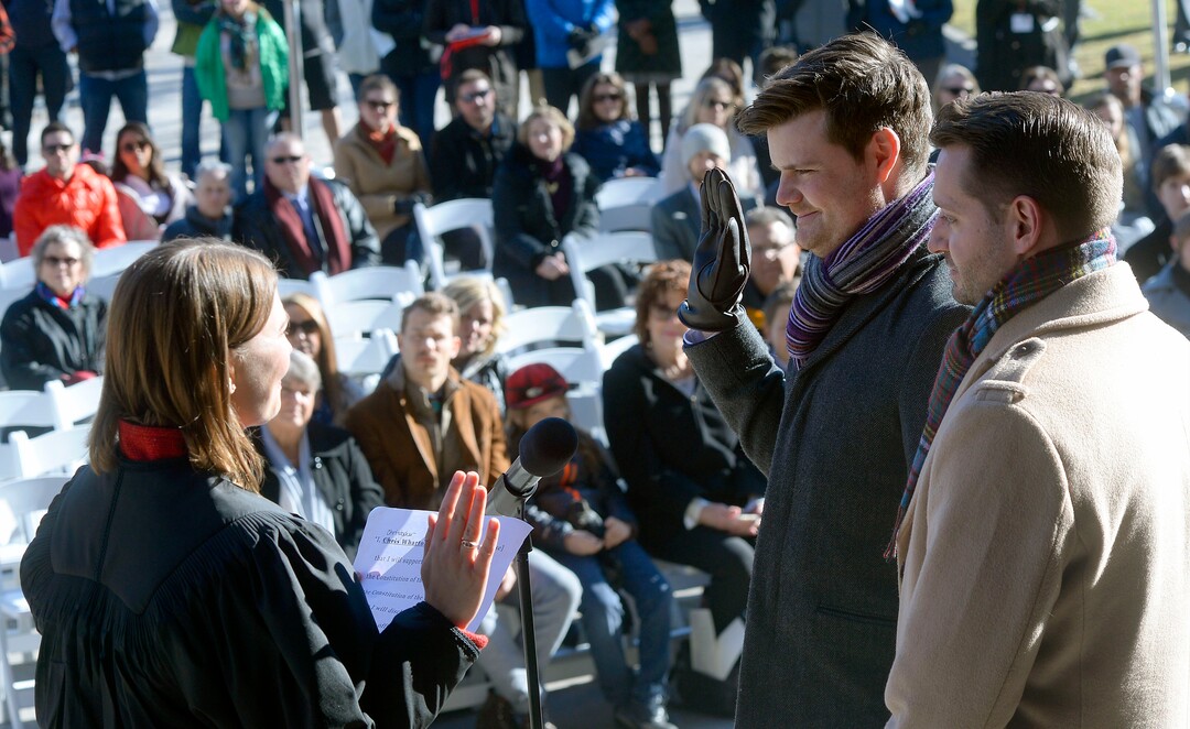 (Al Hartmann  |  The Salt Lake Tribune) 	Honorable Justice Paige Petersen, Utah Supreme Court, left, administers oath of office to newly elected City Council Member Chris  Wharton in ceremony outside the City-County Building Tuesday Jan. 2.  His husband Chris jensen, right. 