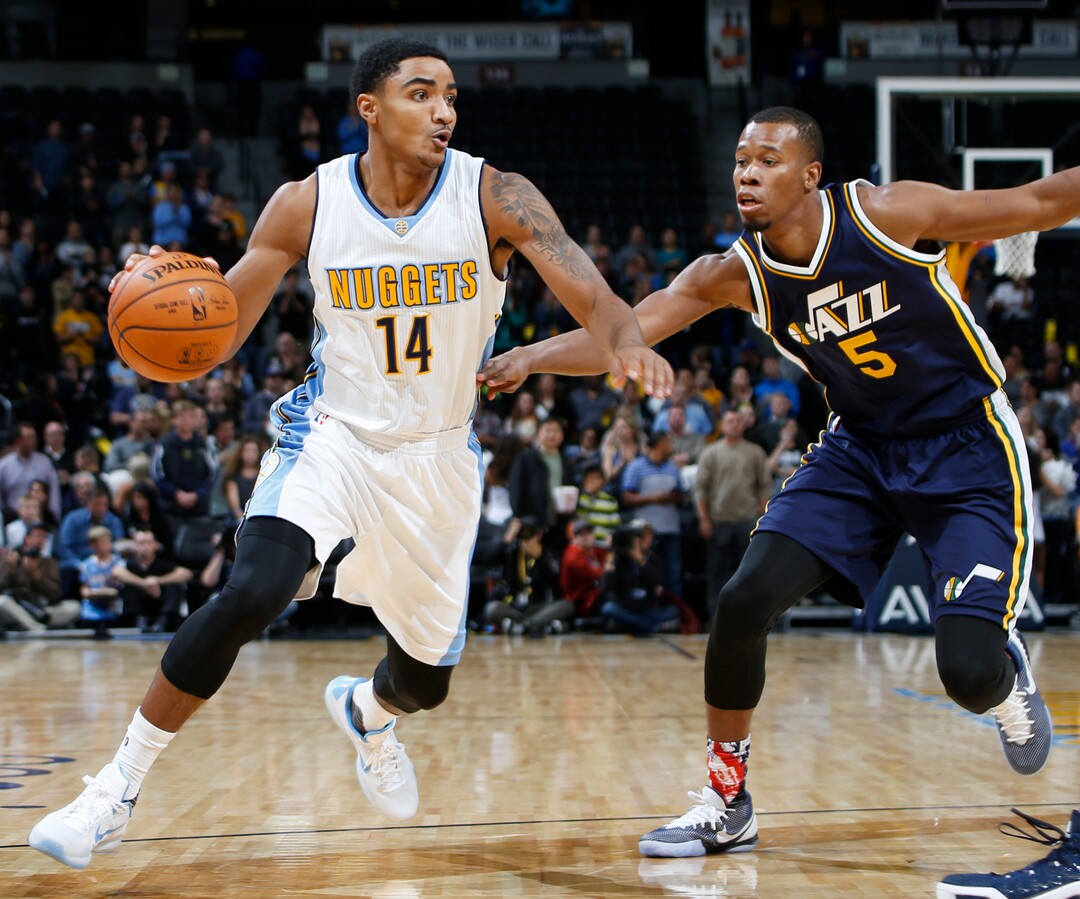 Denver Nuggets guard Gary Harris, left, drives for a shot as Utah Jazz guard Rodney Hood defends in the first half of an NBA basketball game Thursday, Nov. 5, 2015, in Denver. (AP Photo/David Zalubowski)