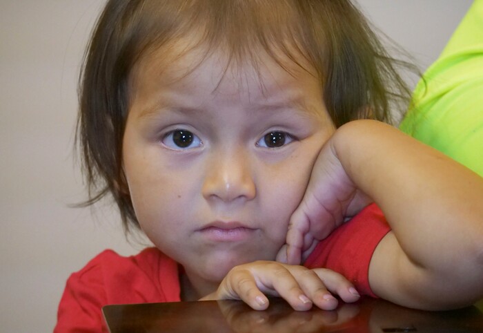Romulo Gonzalez Rodriguez's 3-year-old daughter Genesis looks on during a interview Tuesday, June 19, 2018, in Provo, Utah. Gonzalez Rodriguez spoke about the anguish of being separated from his 3-year-old daughter, Genesis Gonzalez Lopez, for seven days in November after arriving to the U.S. port of entry in San Diego. Gonzalez Rodriguez said he fled his hometown of Champerico, Guatemala to seek asylum in the United States after he was kidnapped and extorted by captors who cut his eye out and nearly killed him. (AP Photo/Rick Bowmer)