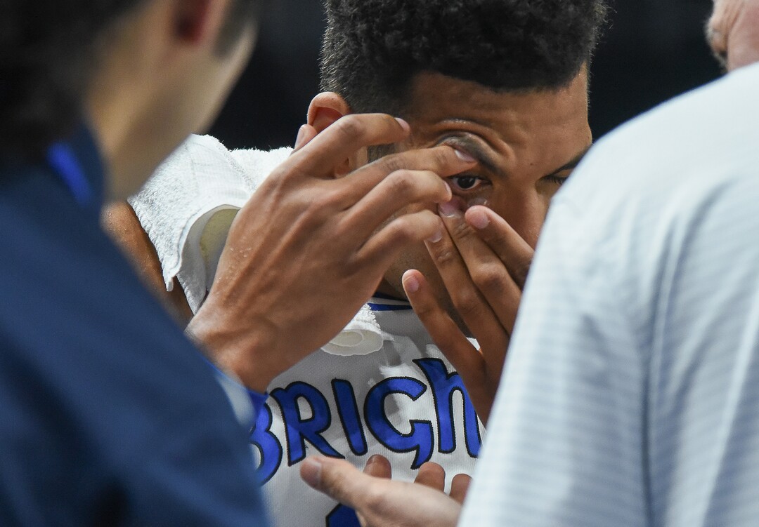 (Francisco Kjolseth  |  The Salt Lake Tribune)  Brigham Young Cougars forward Yoeli Childs (23) take a moment to put his contact lens back in during the game against UNLV in men's NCAA basketball at Vivint Smart Home Arena in Salt Lake City on Sat. Dec. 7, 2019.