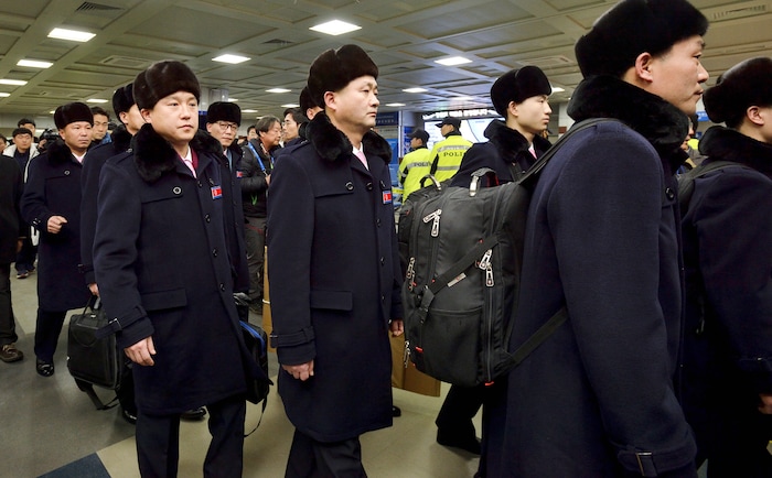 A North Korean delegation and athletes arrive at the Yangyang International Airport in Yangyang, South Korea, Thursday, Feb. 1, 2018. North Korean skiers and skaters on Thursday arrived at a South Korean airport to participate in the Winter Olympics that has brought a temporary lull in tensions surrounding their country's nuclear program. (Korea Pool/Yonhap via AP)