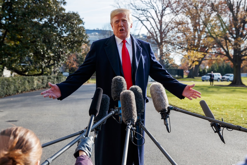 FILE - In this Dec. 7, 2018, file photo, President Donald Trump announces that he is nominating William Barr as his Attorney General, on the South Lawn of the White House, in Washington. Barr, once questioned the effectiveness of a border wall similar to the one the president now wants to construct. Barr was attorney general under President George H.W. Bush when he was asked in a 1992 interview if he supported a proposal from Republican challenger Pat Buchanan to erect a barrier of ditches and fences along the Mexican border to stem the flow of illegal immigrants. Barr described a side-to-side barrier as “overkill.” (AP Photo/Evan Vucci, File)