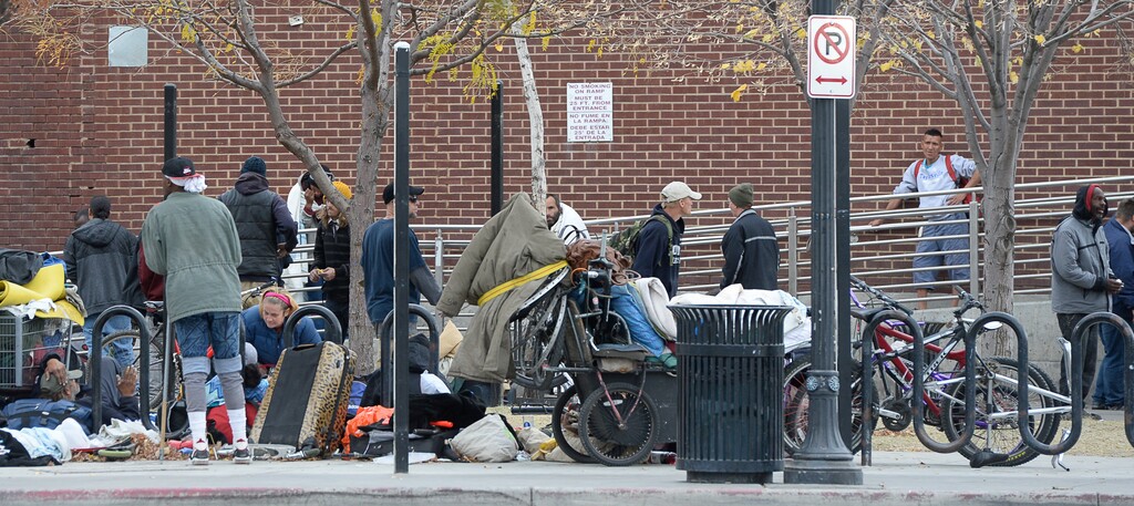 (Francisco Kjolseth  |  The Salt Lake Tribune)  Homeless people gather outside the Road Home Shelter along 500 W. in Salt Lake on Friday, Nov. 3, 2017.