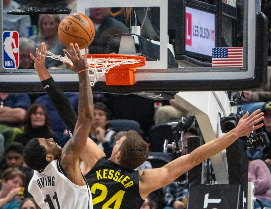 (Rick Egan | The Salt Lake Tribune) Brooklyn Nets guard Kyrie Irving (11) goes in for a dunk, as Utah Jazz center Walker Kessler (24) gets tangled up in the net, in NBA action between the Utah Jazz and the Brooklyn Nets at Vivint Arena, on Friday, Jan. 20, 2023.