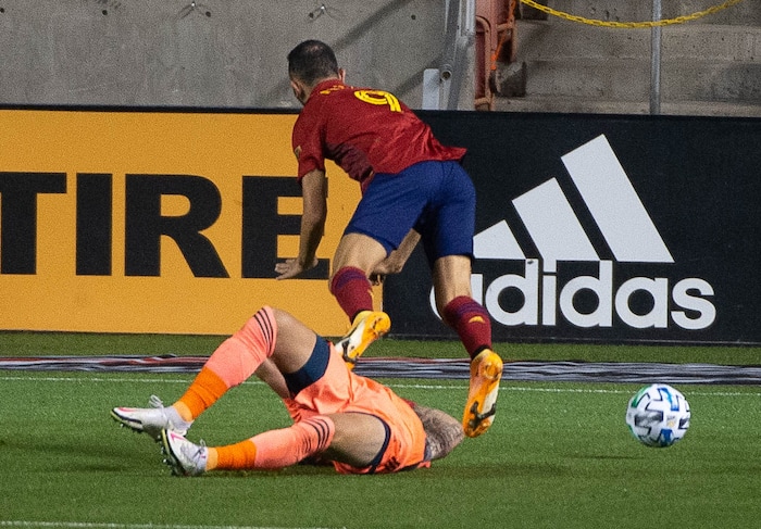 (Francisco Kjolseth  |  The Salt Lake Tribune) Los Angeles Galaxy goalkeeper David Bingham (1) draws the yellow card taking out the legs of Real Salt Lake forward Justin Meram (9) allowing a penalty kick and a first goal for RSL as Real Salt Lake hosts L.A. Galaxy at Rio Tinto Stadium in Sandy on Wednesday, Sept. 23, 2020.