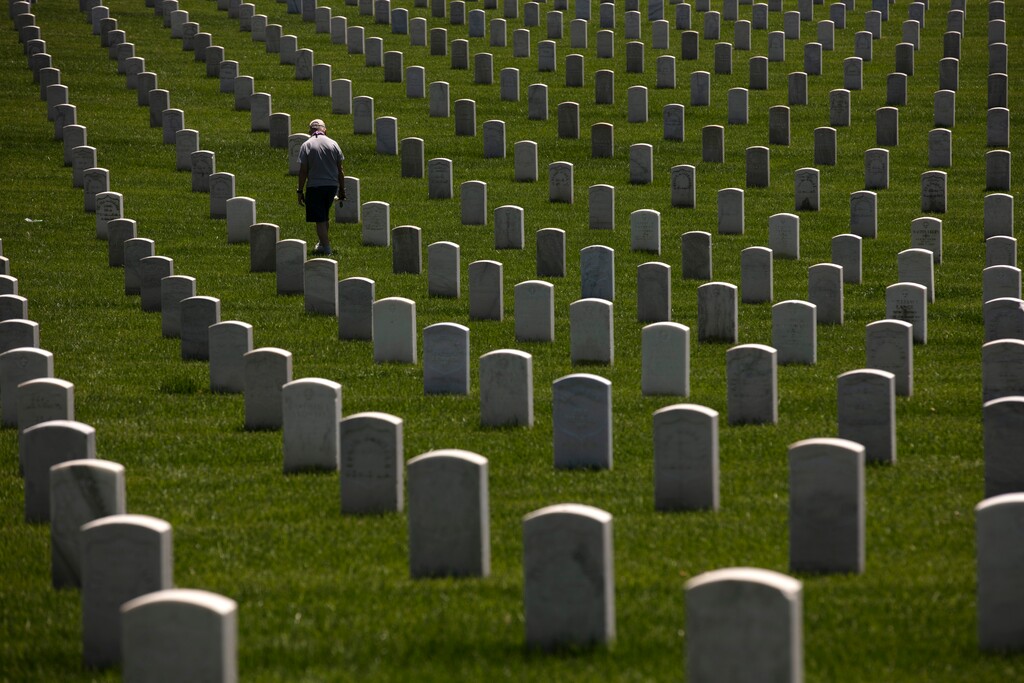 (Jae C. Hong | AP file photo)  John Bickler visits the Los Angeles National Cemetery in Los Angeles, Monday, May 25, 2020.