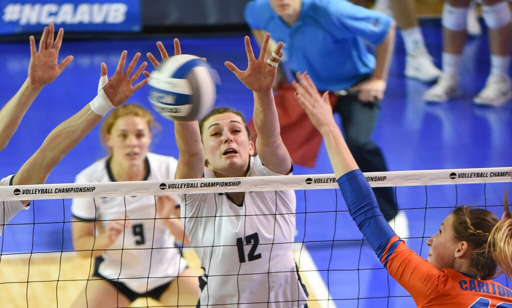 Tribune file photo by Francisco Kjolseth. BYU's Roni Jones-Perry, putting on the block here in a Sweet 16 match against Florida on Dec. 7, was named a first-team All-America and will lead the Cougars into the Final Four against Stanford in Minneapolis, Minn.