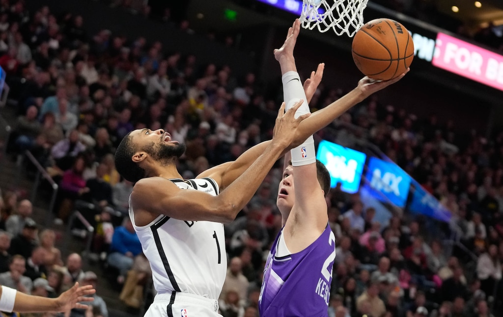 (Francisco Kjolseth  |  The Salt Lake Tribune) Brooklyn Nets forward Mikal Bridges (1) tries to evade the block attempt by Utah Jazz center Walker Kessler (24) during NBA basketball in Salt Lake City Monday, Dec. 18, 2023.