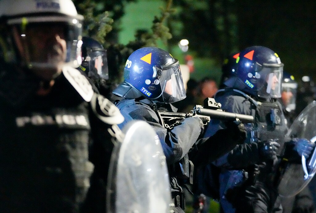(Bethany Baker  |  The Salt Lake Tribune) A law enforcement officer aims a paintball gun at protesters during the pro-Palestine rally at the University of Utah in Salt Lake City on Monday, April 29, 2024.