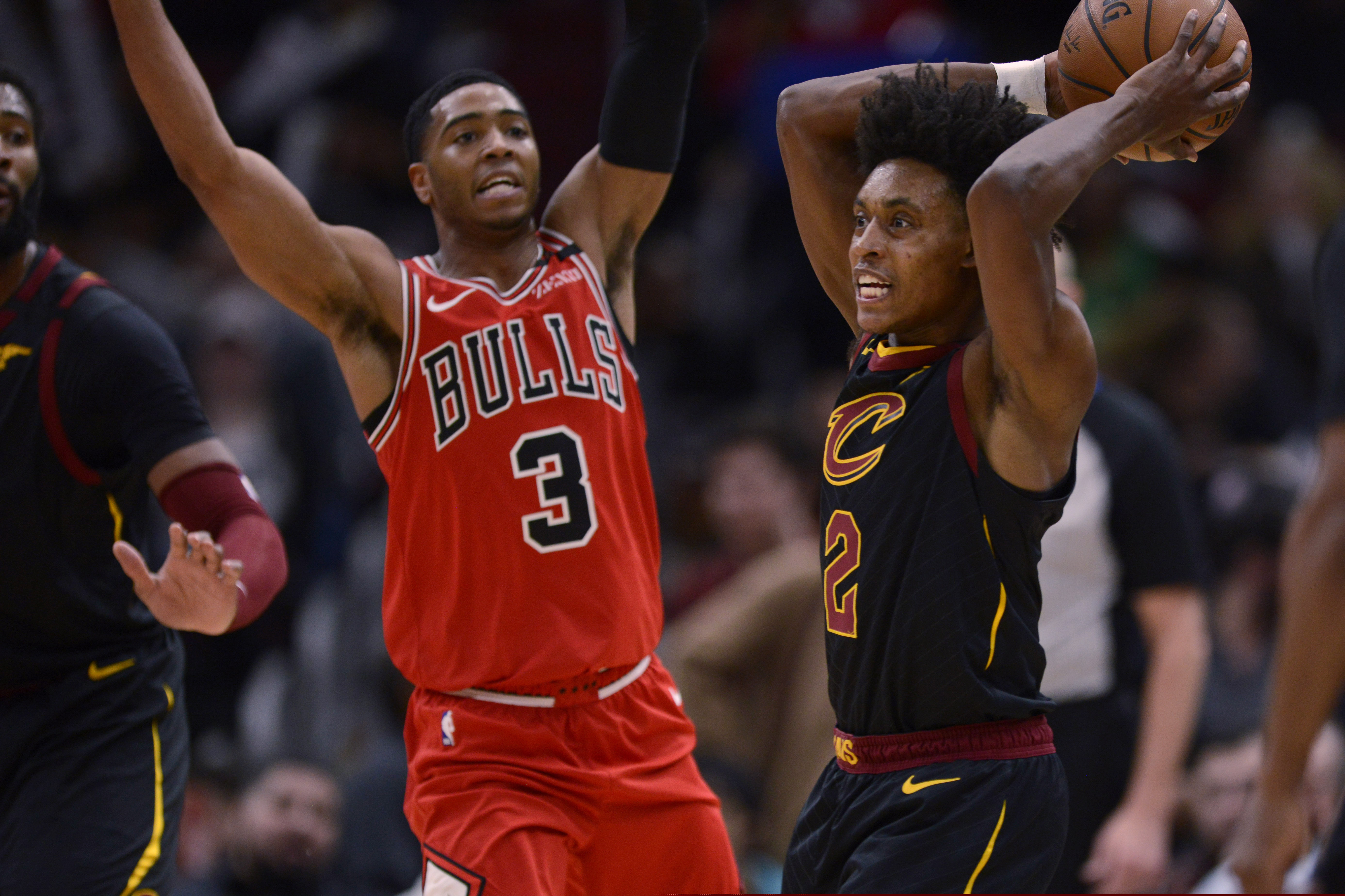 Cleveland Cavaliers' Collin Sexton, (2) looks to pass the ball as Chicago Bulls' Shaquille Harrison (3) defends during the second half of an NBA basketball game Tuesday, March 10, 2020, in Chicago. (AP Photo/Paul Beaty)