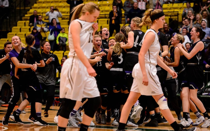 (Trent Nelson | The Salt Lake Tribune)
Lehi vs. Desert Hills, 4A State high school basketball tournament at Utah Valley University in Orem, Thursday March 1, 2018. Lehi players rush the court to celebrate their win.