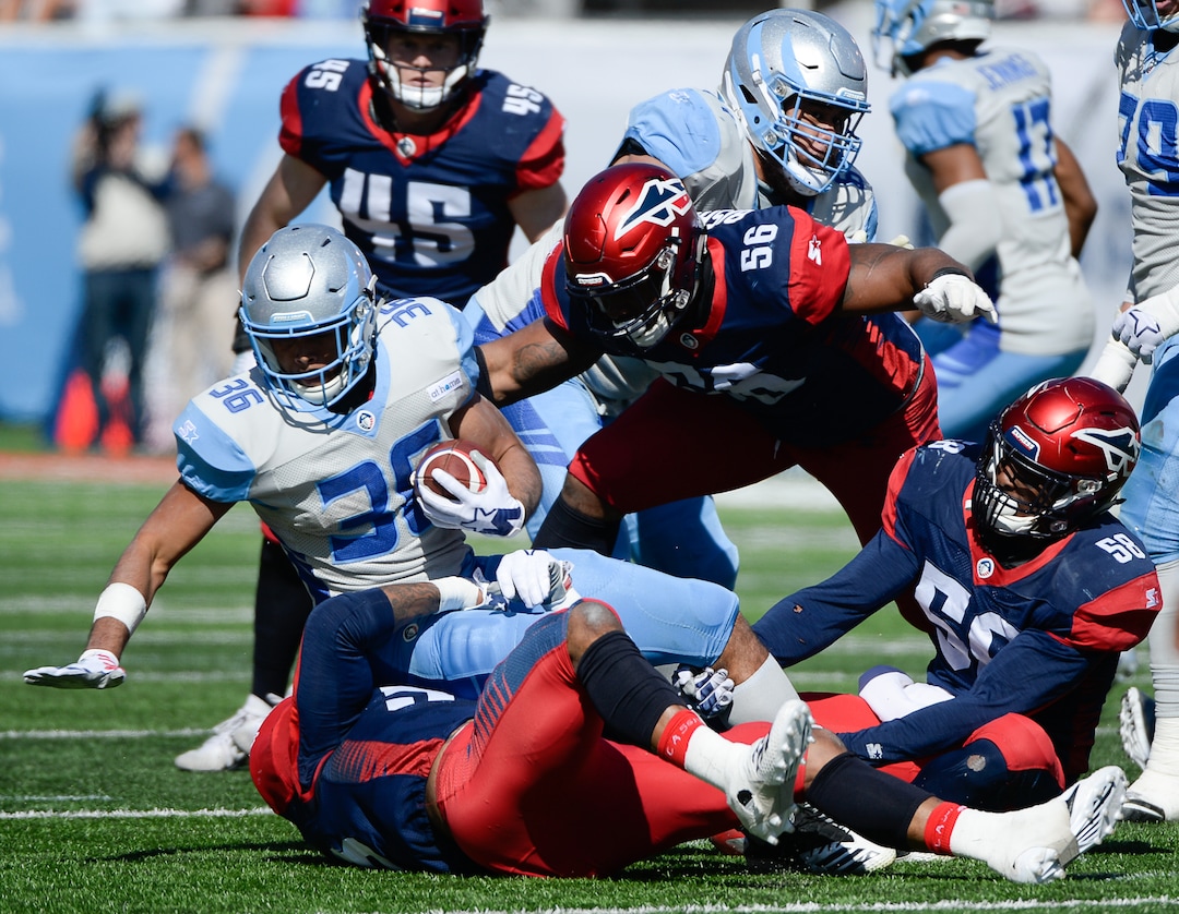 (Francisco Kjolseth  |  The Salt Lake Tribune)  Joel Bouagnon #36 of the Salt Lake Stallions is taken down by  the Memphis Express of the Alliance of American Football in Salt Lake City on Saturday March 16, 2019.