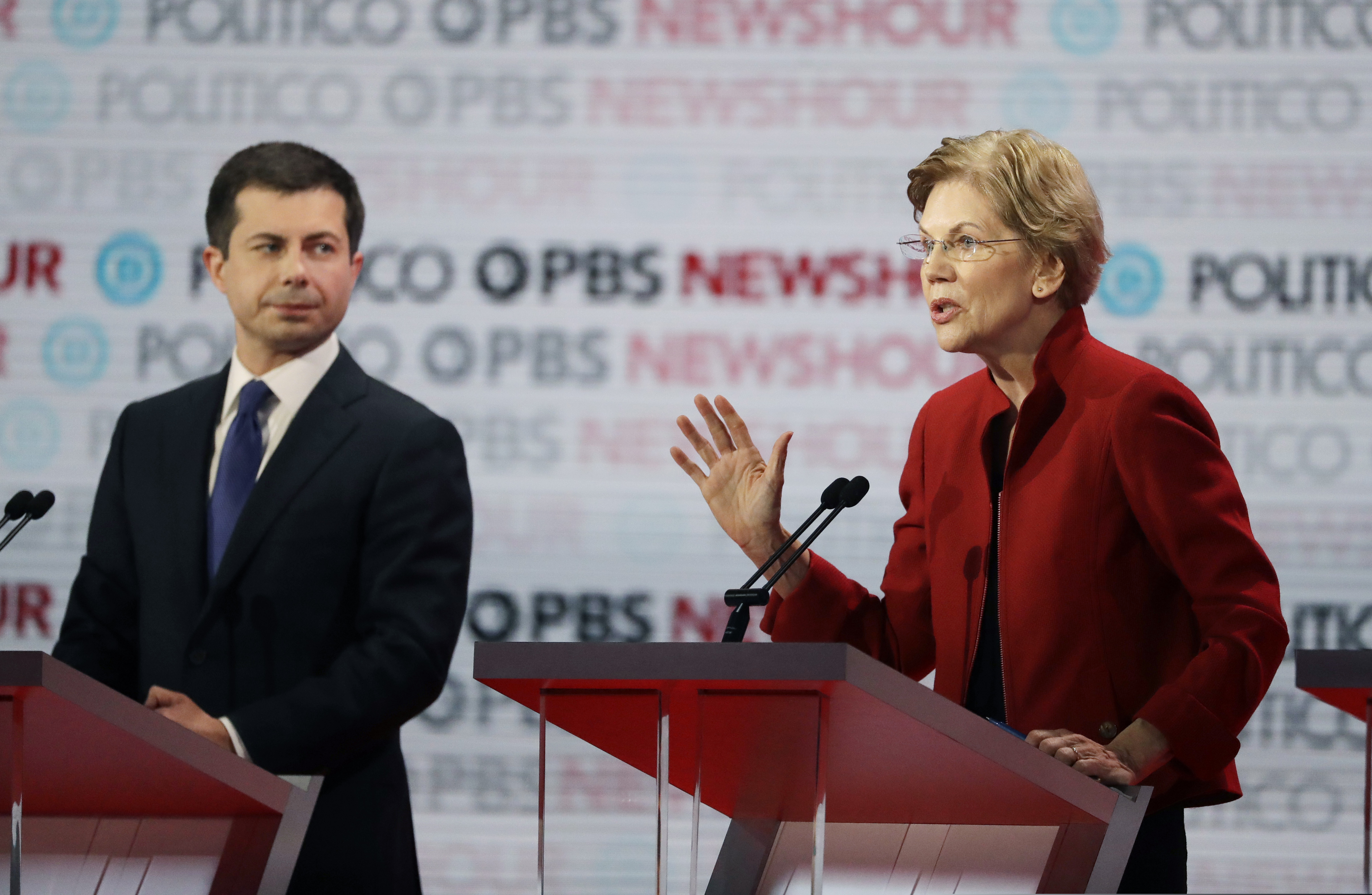 (Chris Carlson | AP) Democratic presidential candidate Sen. Elizabeth Warren, D-Mass., right, speaks as South Bend Mayor Pete Buttigieg listens during a Democratic presidential primary debate Thursday, Dec. 19, 2019, in Los Angeles.
