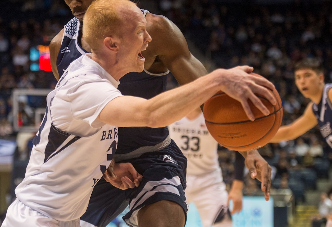 (Rick Egan  |  The Salt Lake Tribune)  Brigham Young Cougars guard TJ Haws (30) collides with Rice Owls guard Josh Parrish (1), in basketball action between Brigham Young Cougars and Rice Owls, at the Marriott Center in Provo, Wednesday, Nov. 21, 2018.