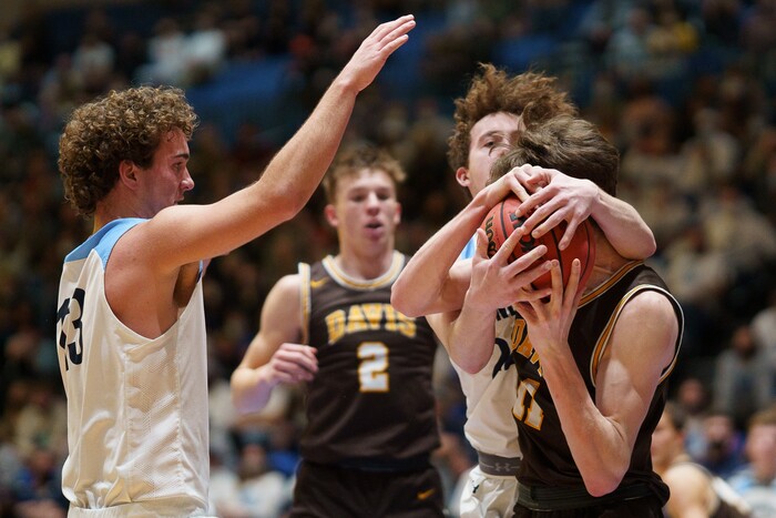 (Trent Nelson  |  The Salt Lake Tribune) Westlake's Kaden Hoppins wraps up Davis's Henry Ihrig as Davis defeats Westlake High School in the 6A boys basketball state championship game, in Taylorsville on Saturday, March 6, 2021.