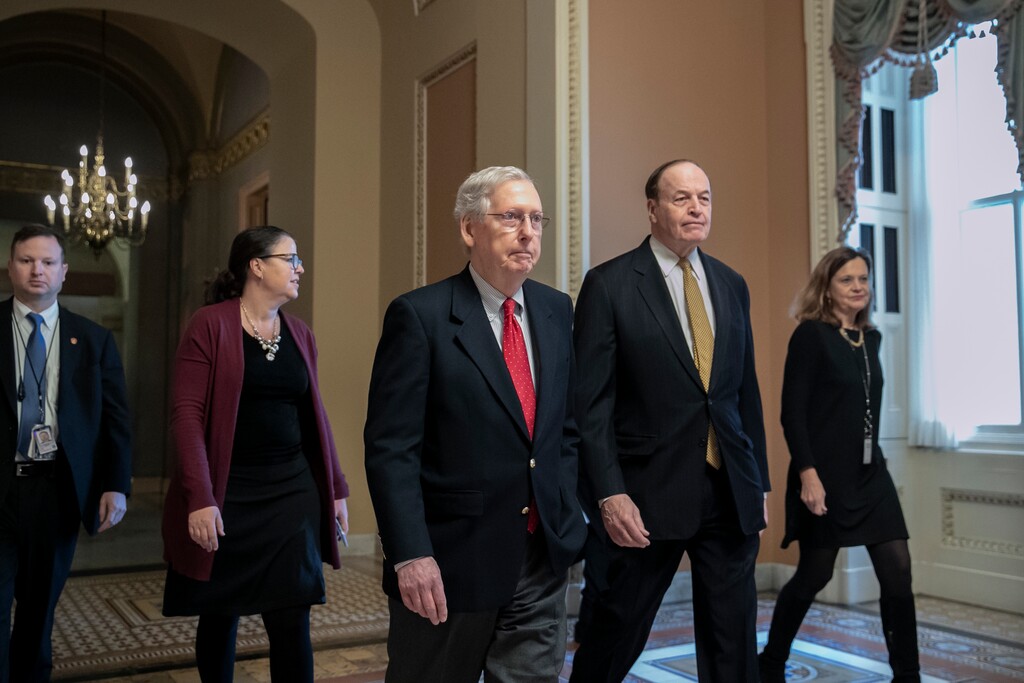 (AP Photo/J. Scott Applewhite) En route to a meeting at the White House, Senate Majority Leader Mitch McConnell, R-Ky., left, walks with Sen. Richard C. Shelby, R-Ala., chairman of the Senate Appropriations Committee, as work continues prior to a Friday night funding deadline to avoid a partial government shutdown, in Washington, Friday, Dec. 21, 2018. Trump is imploring McConnell to change the Senate's rules in order to pass the spending bill with money for a border wall.