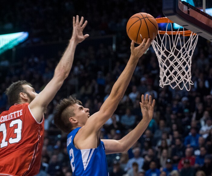 (Rick Egan  |  The Salt Lake Tribune) Brigham Young guard Zac Seljaas (2) gets past Utah Utes forward David Collette (13) to score for the Cougars, in basketball action Utah Utes vs. Brigham Young Cougars at the Marriott Center in Provo, Saturday, December 15, 2017.


