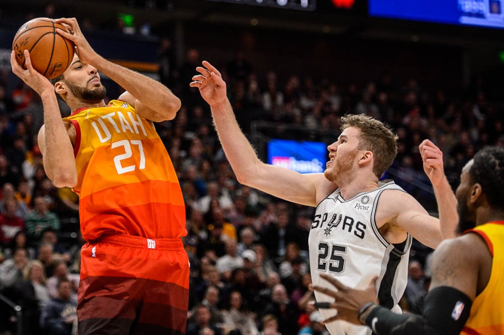 (Trent Nelson | The Salt Lake Tribune)  Utah Jazz center Rudy Gobert (27) rebounds ahead of San Antonio Spurs center Jakob Poeltl (25) as the Utah Jazz host the San Antonio Spurs, NBA basketball in Salt Lake City on Saturday Feb. 9, 2019.