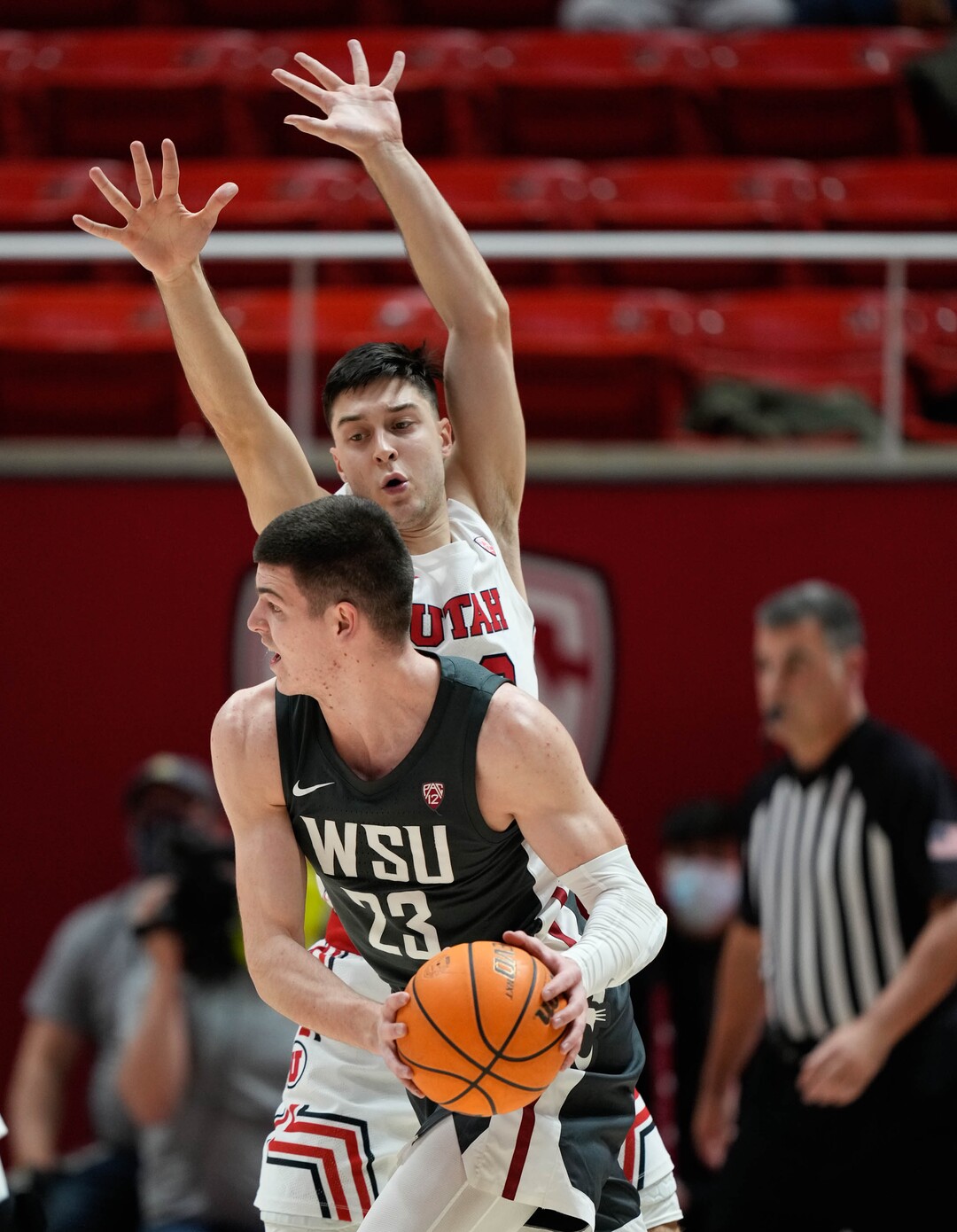 (Francisco Kjolseth | The Salt Lake Tribune) Washington State Cougars forward Andrej Jakimovski (23) is defended by Utah Utes guard Lazar Stefanovic (20) during an NCAA college basketball game at the Jon M.Huntsman Center, on Saturday, Jan. 8, 2022. Utah lost 61-77.